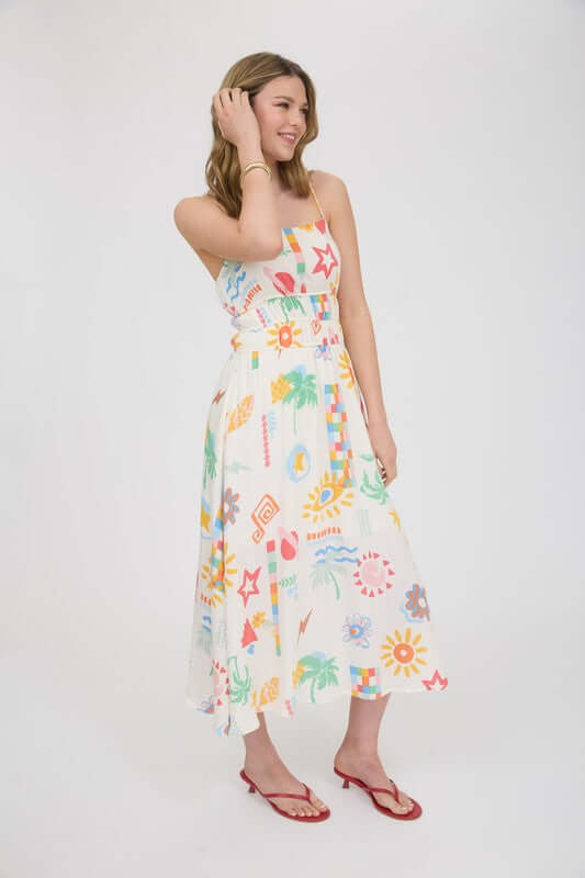 Model wearing the Destin Maxi Dress, a multicolor summer sundress with spaghetti straps and shirred waist.