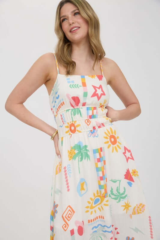 Model wearing the Destin Maxi Dress, a sleeveless multicolor midi sundress with adjustable spaghetti straps.