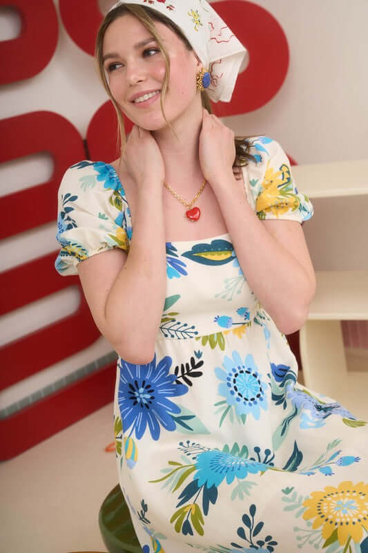 Florence Maxi Dress featuring square neckline, short puff sleeves, and colorful floral print for a trendy look.