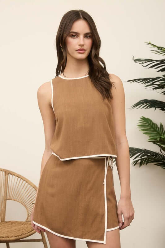 Maddie Linen Skort Matching Set featuring high waist, front wrap detail, and side tie in brown with contrast trim.