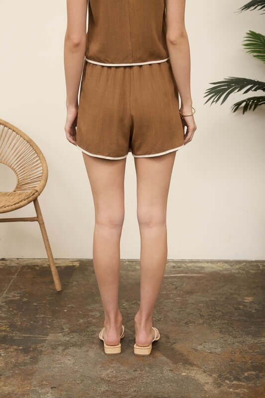 Back view of the Maddie Linen Skort Matching Set featuring side tie and contrast trim details.