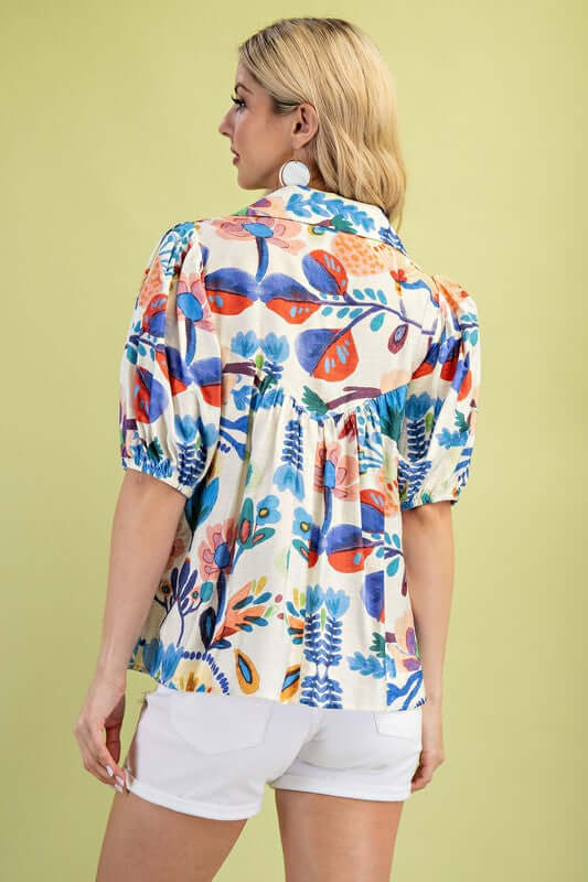 Back view of Summer Nights Collared Blouse featuring colorful floral patterns and tie strings, perfect for summer outfits.