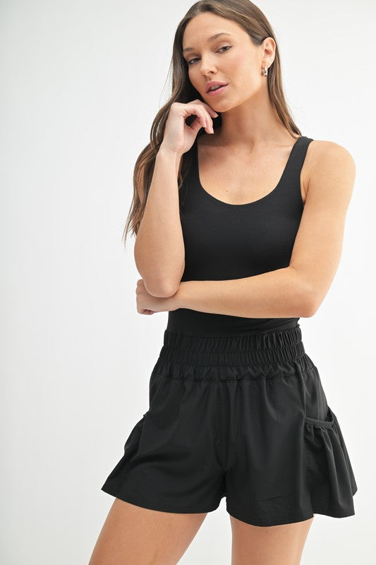 Flounce & Flow Active Romper in Black